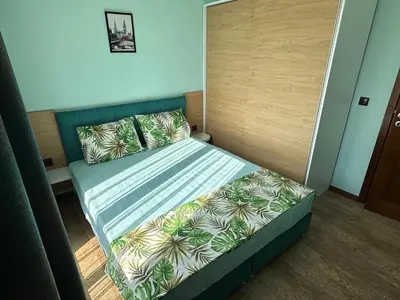 a small bedroom with a bed in a room at Апартаменти в Комплекс Трявна Бийч in Sveti Vlas