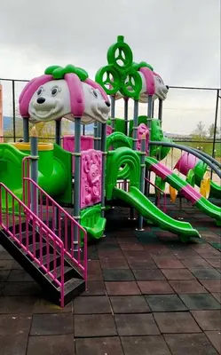 a playground with a green and pink slide at Studio in Sunny day 6 complex in Sunny Beach