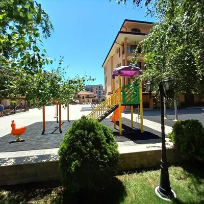 a playground with a slide in the middle of a street at Star Dreams Apartment with Glass Veranda in Sveti Vlas