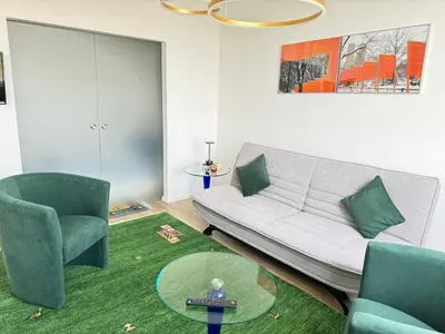 a living room with a couch and two chairs at Luxus living in Burgas in Burgas City
