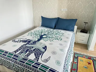 a bedroom with a bed with an elephant design on it at Luxus living in Burgas in Burgas City