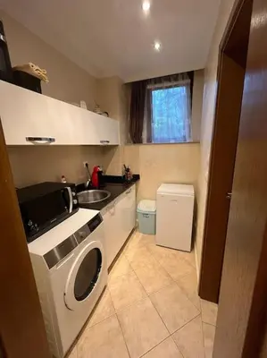 a kitchen with a washing machine and a sink at 1 Apartment Verano Del Mar Sozopol in Sozopol