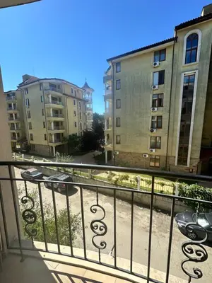a balcony with a view of some buildings at Apart Hotel Avalon in Sunny Beach