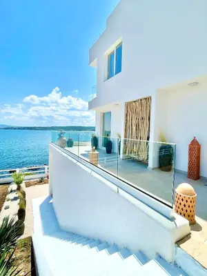 a white house with a view of the water at Casa de oro Lujo in Sozopol