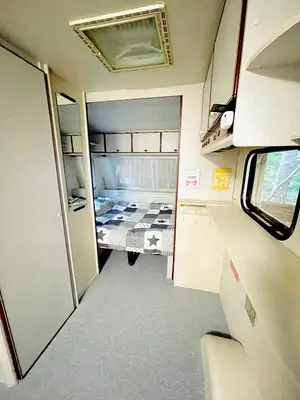 an interior view of an rv with a bed in it at Каравана Безвремие in Chernomorets