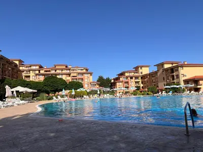a large swimming pool in a resort with buildings at the magic dream, Sveti Vlas in Sveti Vlas