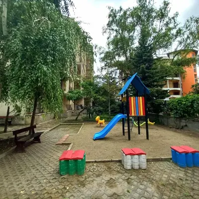 a playground with a slide at Rose Village Private Apartment in Sunny Beach