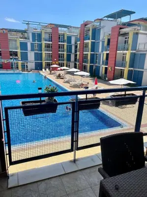 a view of a swimming pool from a balcony at Апартамент за нощувки в ЕЛИТ 4 Слънчев бряг in Sunny Beach