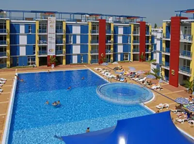 a large swimming pool in front of a building at Апартамент за нощувки в ЕЛИТ 4 Слънчев бряг in Sunny Beach