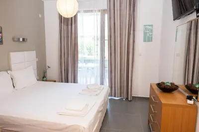 a bedroom with a bed with towels on it at Apartment in Paradise View complex in Sozopol