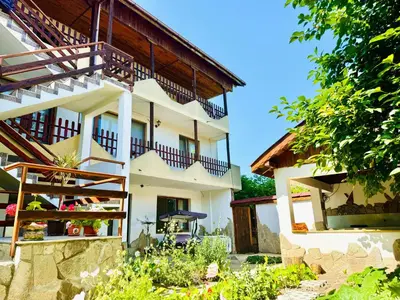 a house with balconies on the side of it at Къща за Гости Чайка in Byala