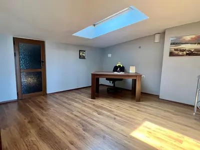 an empty room with a table and a skylight at Vista Sul Mare V in Kraymorie