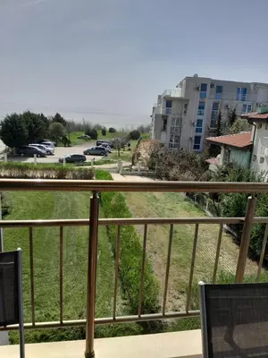a balcony with a view of a parking lot at студио Орхидея Сарафово лукс с изглед към морето in Burgas City