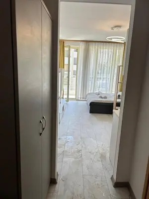 a room with a door leading to a bedroom at Studio Dream Мечта in Sunny Beach