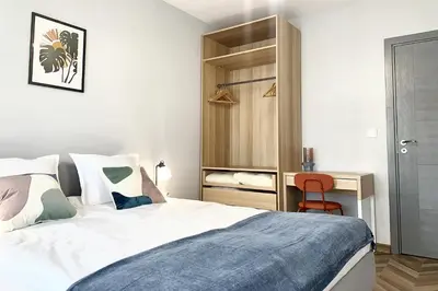 a bedroom with a bed and a desk with a chair at 