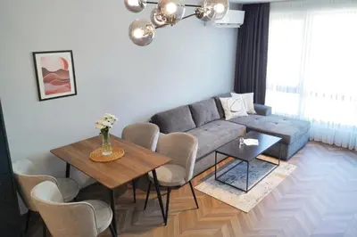 a living room with a couch and a table at 