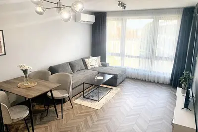 a living room with a couch and a table at 