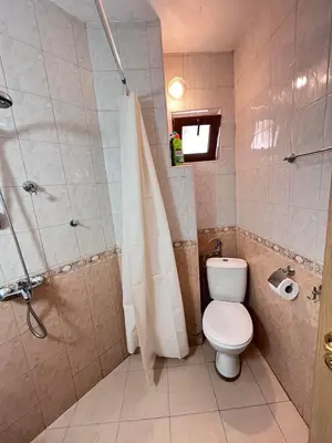 a bathroom with a toilet and a shower at Apartment Divna in Sozopol