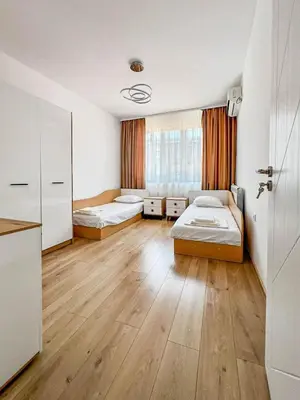 a large room with two beds and a kitchen at Апартамент Tiana in Tsarevo