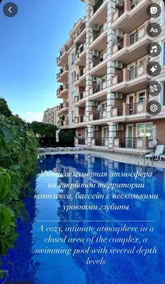 a sign in front of a building next to a swimming pool at Mint Casa Rossa in Sunny Beach