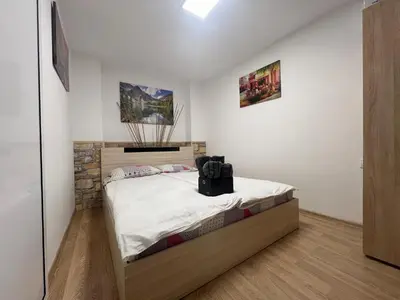 a bedroom with a bed in a room at Varna Central Sea Apartment in Varna City