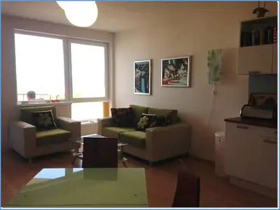 a living room with two couches and a table at Nice 2 Bedrooms With Ocean View In Byala in Byala
