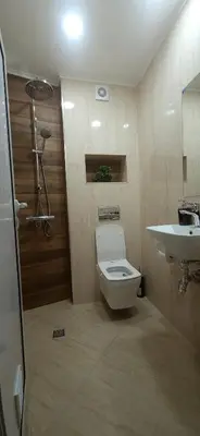 a bathroom with a toilet and a sink at Aпартамент Жужа in Nesebar