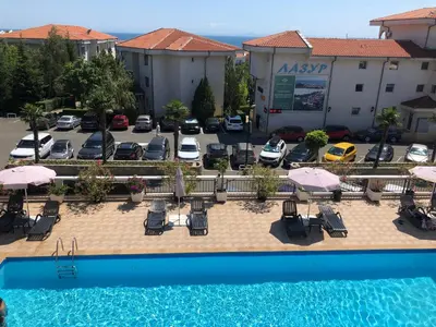 an overhead view of a parking lot with a pool at 2 bedroom apartment Sveti Vlas with 2 balconies and sea views in Sveti Vlas