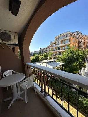 a balcony with a table and chairs and a view at 2 bedroom apartment Sveti Vlas with 2 balconies and sea views in Sveti Vlas