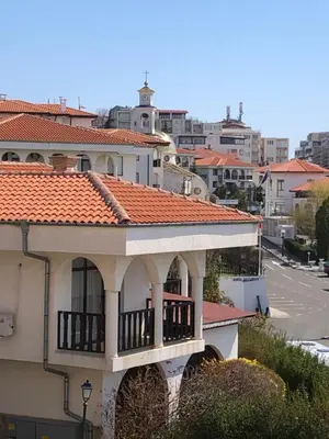 a house with an orange roof and a balcony at 2 bedroom apartment Sveti Vlas with 2 balconies and sea views in Sveti Vlas