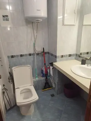 a bathroom with a toilet and a sink at California complex in Sunny Beach