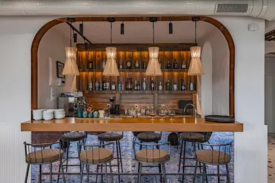 a bar with bar stools in a room at Casa Deniso - The Home of Chill in Byala