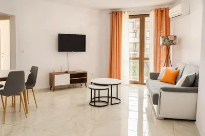 a living room with a couch and a table at Elegant Apartment Artur in Sveti Vlas