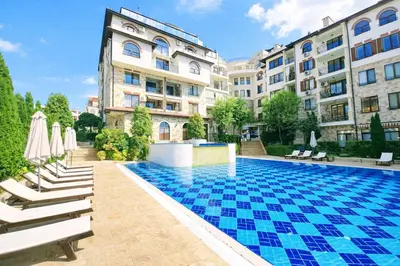 a swimming pool in front of a building at Elegant Apartment Artur in Sveti Vlas