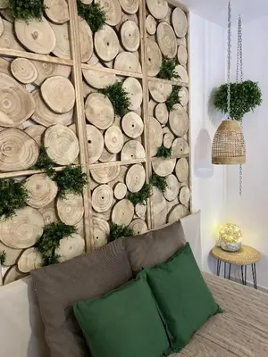 a wall with a wall made out of logs at Apartment Blue Summer II in Varna City