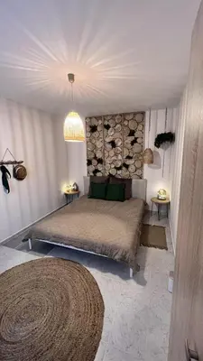 a bedroom with a bed and a chandelier at Apartment Blue Summer II in Varna City