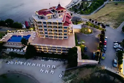 an aerial view of a hotel on the water at Santa Maria Luxury Suits in Ravda
