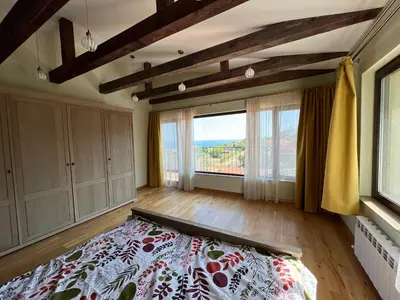 a bedroom with a bed and a large window at Villa Alessandra in Emona