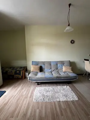 a living room with a couch in a room at 'Oasis' Ravda Apartment, Nessebar in Ravda