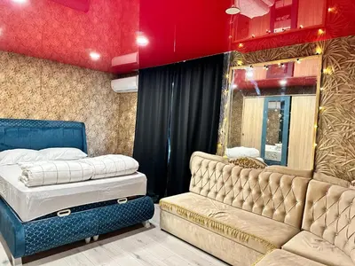 a bedroom with two mattresses and a couch at Double bed room in Nesebar
