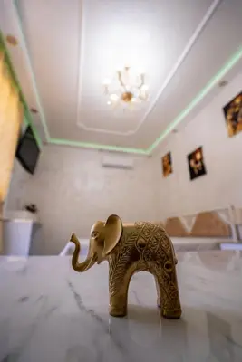 a figurine of an elephant sitting on a table at AR Luxury Apartments Ravda in Ravda