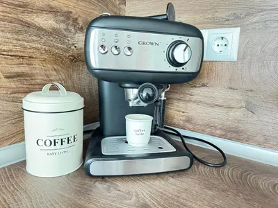 a coffee machine and a cup on a counter at Deco Fusion in Sozopol