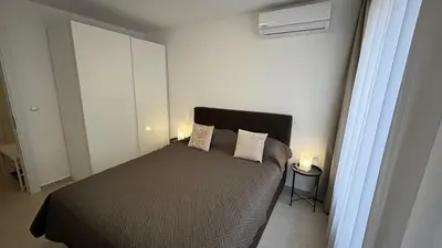 a bedroom with a bed with two pillows on it at Polar Star 106 B in Saint Vlas in Sveti Vlas