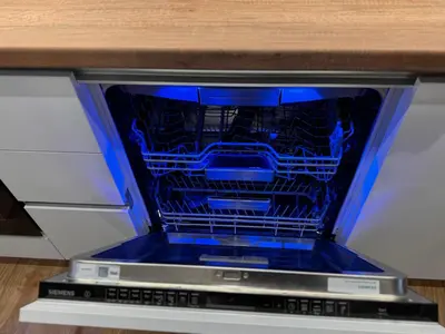 a dishwasher with its door open with at Goldy central beach apartment with private garden Burgas in Burgas City