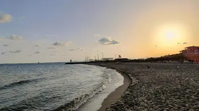 a beach with the sun rising over the ocean at Dolce Vita 1 Infinity Love in Sveti Vlas