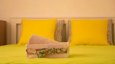 a box sitting on top of a bed at Cozy 1-bedroom apartment 5 min from the beach in Varna City