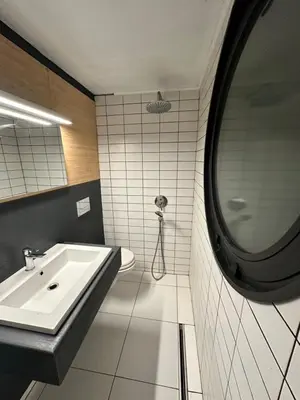 a bathroom with a sink and a mirror at Firstline Beach Camp in Sozopol