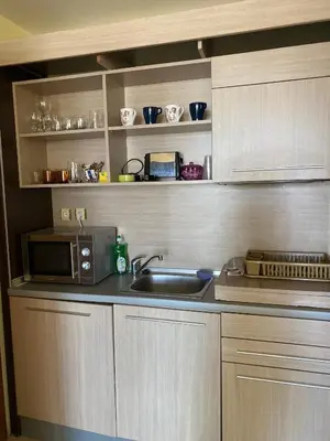 a kitchen with a sink and a microwave at Central Beach Apartament in Sunny Beach