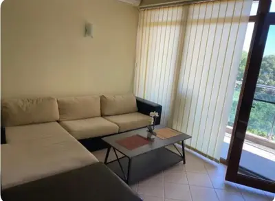 a living room with a couch and a coffee table at Central Beach Apartament in Sunny Beach