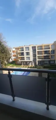 a balcony with a view of a apartment building at Central Beach Ravda Apartments in Ravda